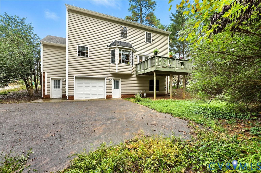 3420 Osborne Road Chester, VA 23831 - Photo 5 of 36 a view of a house with a yard and large tree