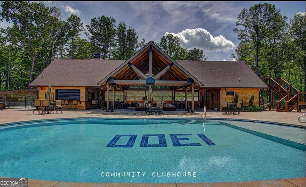 Lot 251 Ridge Pointe Way Blairsville, GA 30512 - Photo 11 of 18 a view of house and garden with swimming pool and outdoor seating