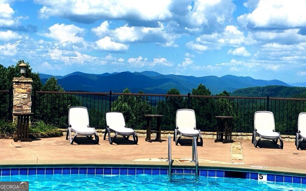 Lot 251 Ridge Pointe Way Blairsville, GA 30512 - Photo 12 of 18 a view of sitting area with furniture and garden view