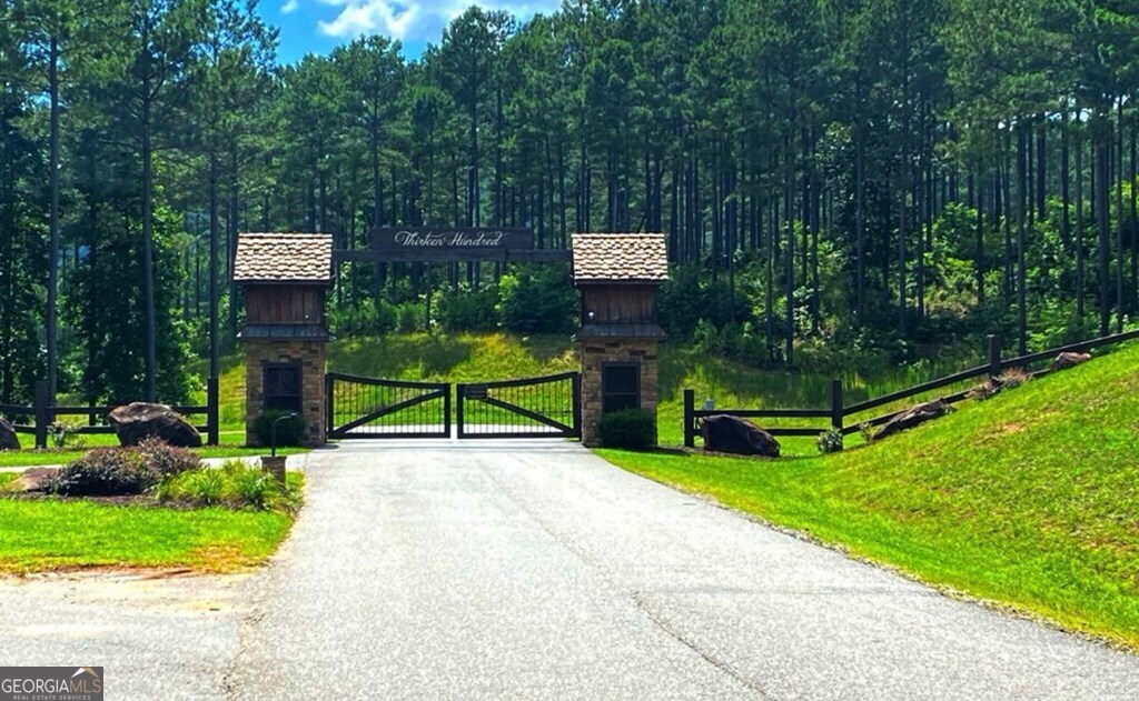 Lot 251 Ridge Pointe Way Blairsville, GA 30512 - Photo 16 of 18 a park view with a bench and trees