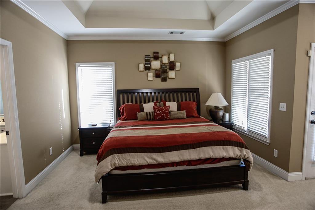 3875 Spring Manor Court Loganville, GA 30052 - Photo 18 of 23 a bedroom with a bed and window