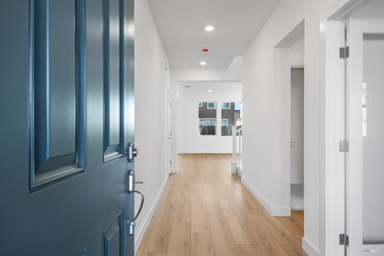 7337 Willowglen Drive Rohnert Park, CA 94928 - Photo 2 of 31 a view of a hallway with wooden floor and staircase