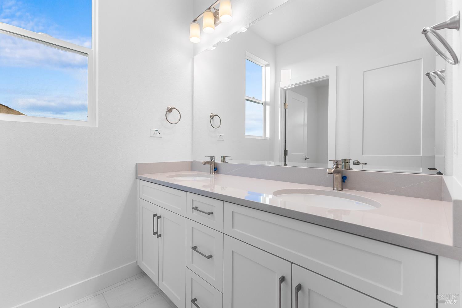 7337 Willowglen Drive Rohnert Park, CA 94928 - Photo 27 of 31 a bathroom with a sink and a mirror