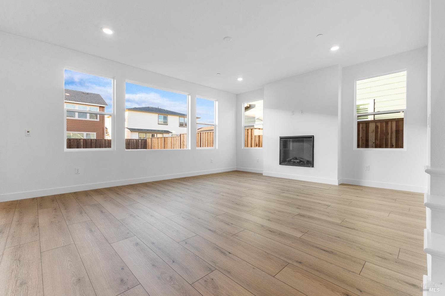 7337 Willowglen Drive Rohnert Park, CA 94928 - Photo 7 of 31 wooden floor in an empty room with a window