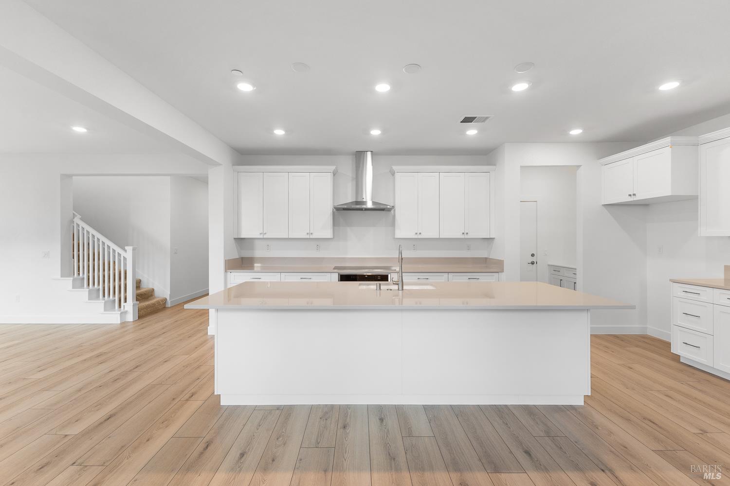 7337 Willowglen Drive Rohnert Park, CA 94928 - Photo 10 of 31 a large kitchen with stainless steel appliances a large counter top a stove and a wooden floors