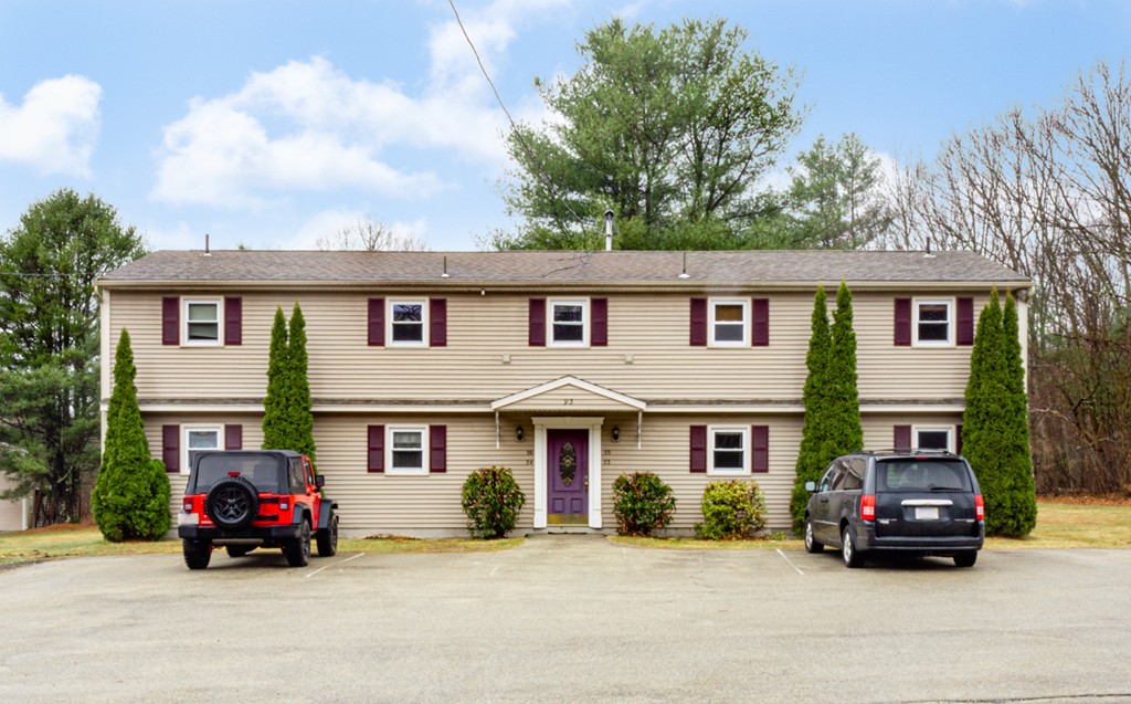 93 Center Depot Road, Unit 55 Charlton, MA 01507 - Photo 1 of 16 a car parked in front of a house