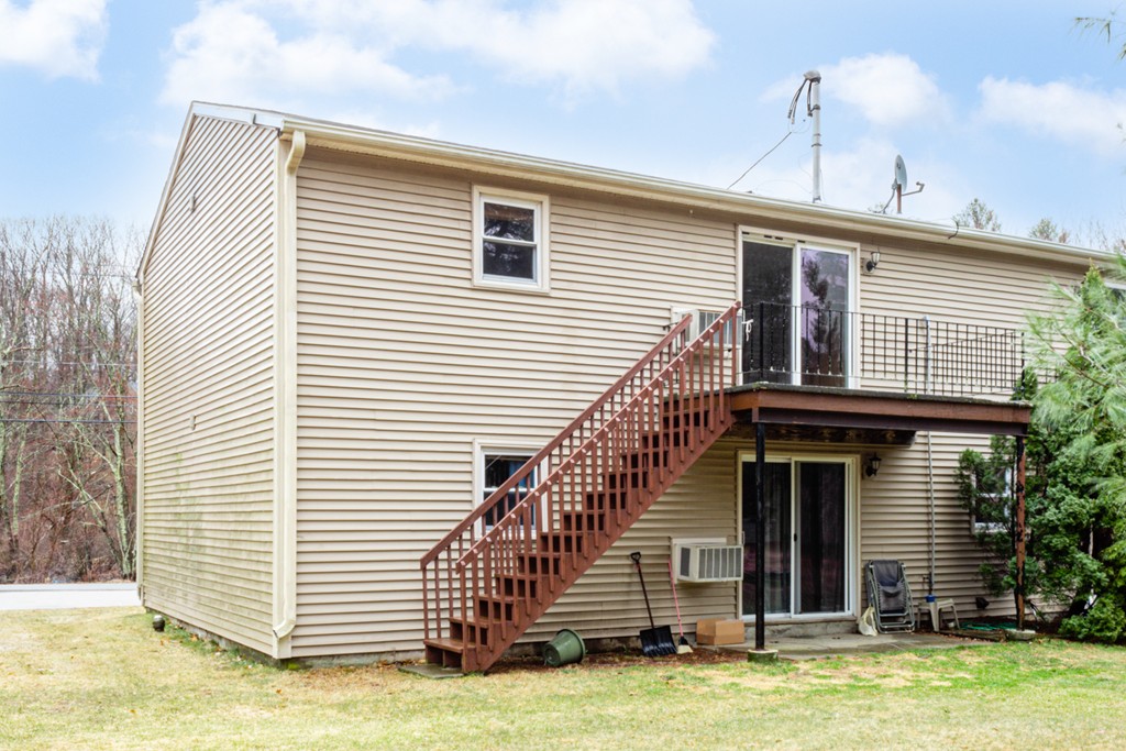 93 Center Depot Road, Unit 55 Charlton, MA 01507 - Photo 15 of 16 a view of a house with a balcony