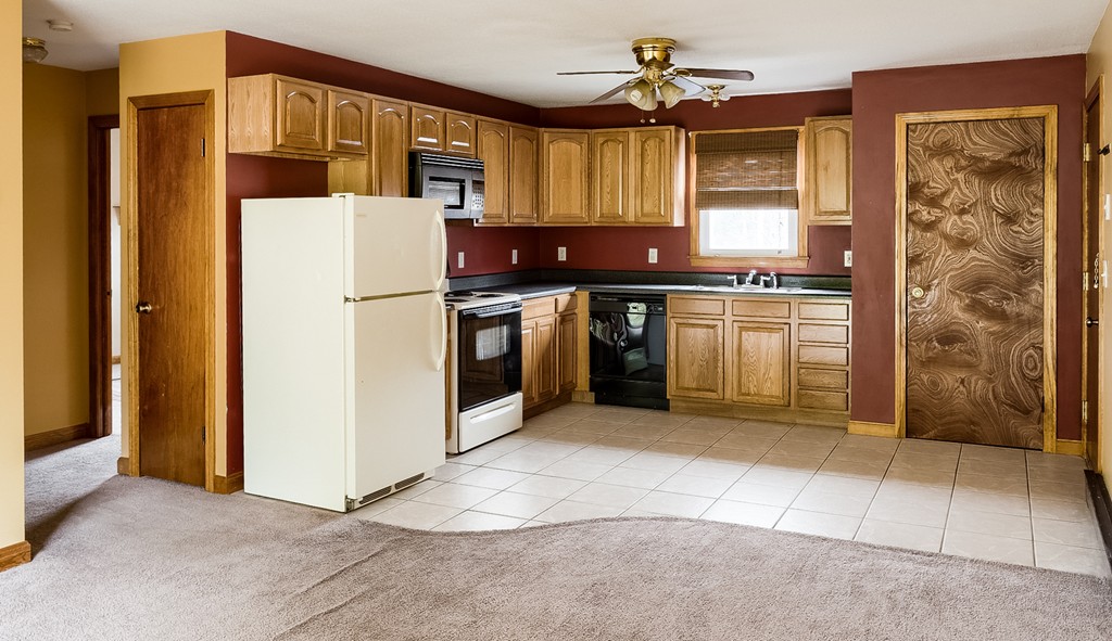 93 Center Depot Road, Unit 55 Charlton, MA 01507 - Photo 3 of 16 a kitchen with cabinets and a stove