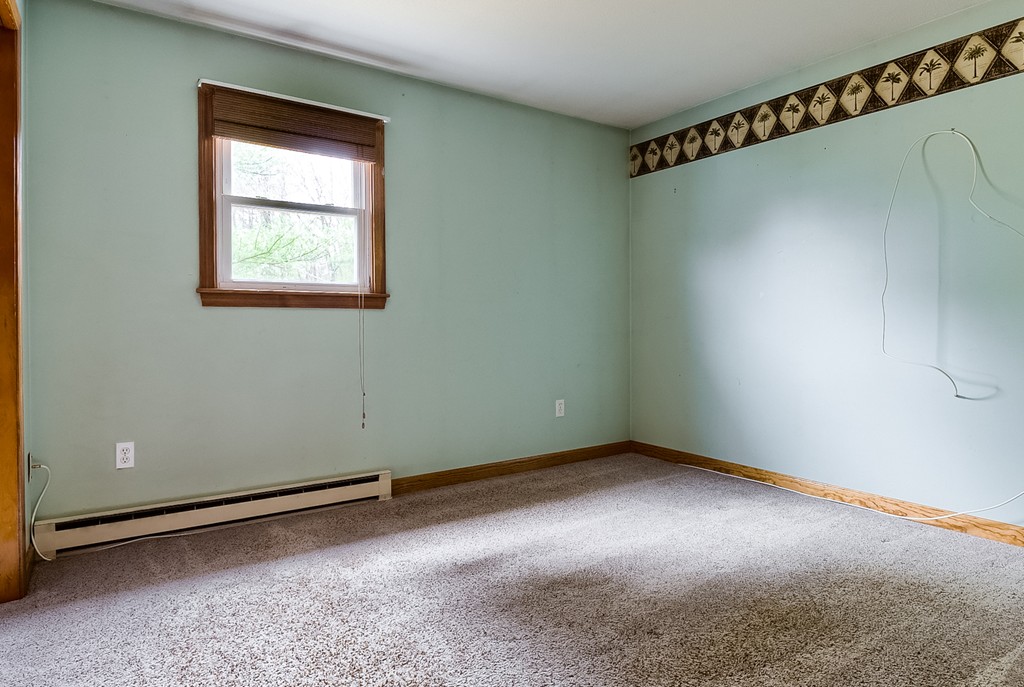 93 Center Depot Road, Unit 55 Charlton, MA 01507 - Photo 9 of 16 an empty room with a window