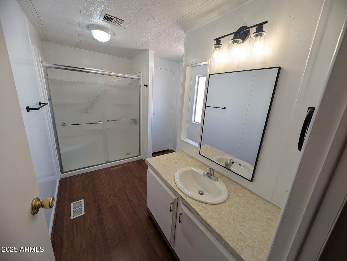 18003 North 2nd Street Phoenix, AZ 85022 - Photo 11 of 31 a bathroom with a sink a mirror and a shower