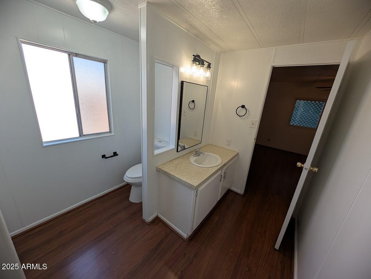 18003 North 2nd Street Phoenix, AZ 85022 - Photo 13 of 31 a bathroom with a toilet sink and mirror