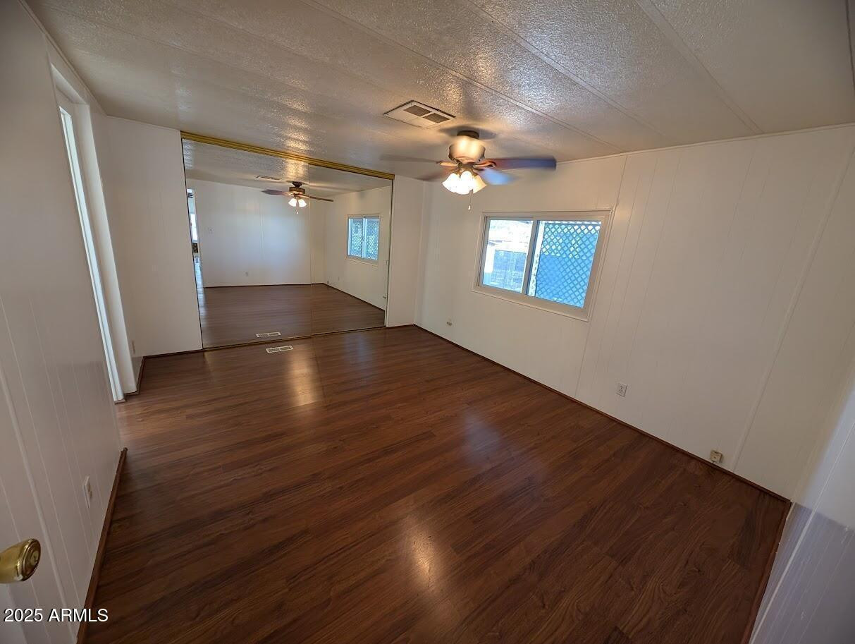18003 North 2nd Street Phoenix, AZ 85022 - Photo 16 of 31 wooden floor in an empty room with a window