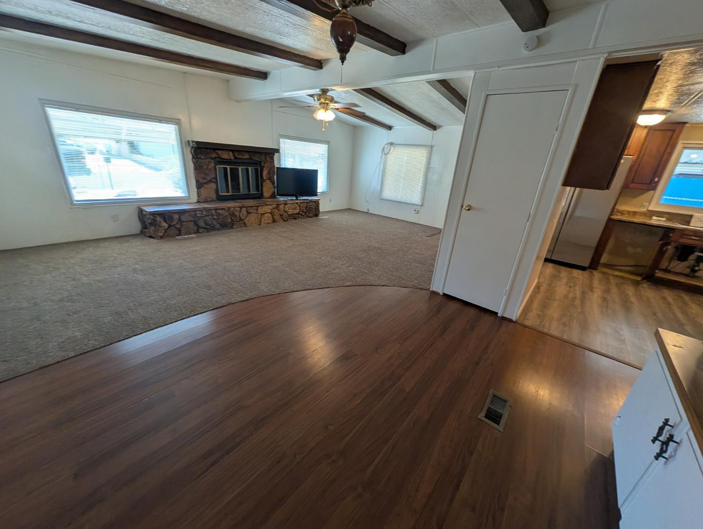 18003 North 2nd Street Phoenix, AZ 85022 - Photo 25 of 31 an empty room with wooden floor and windows