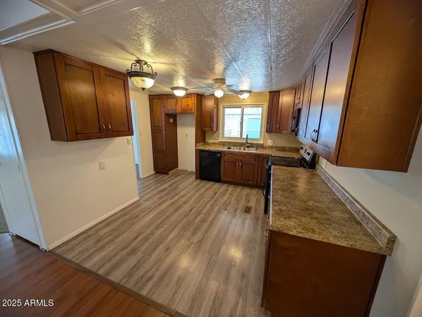 a large bathroom with a tub and a large mirror