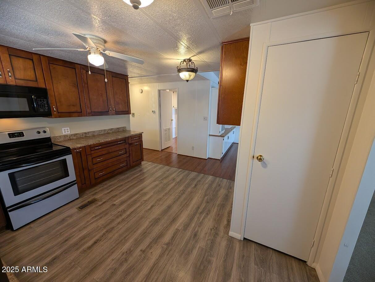 18003 North 2nd Street Phoenix, AZ 85022 - Photo 10 of 31 a view of kitchen with wooden floor and electronic appliances