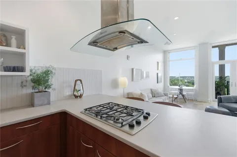 a kitchen with a sink and a stove top oven