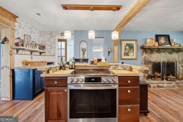 a kitchen with a stove and cabinets