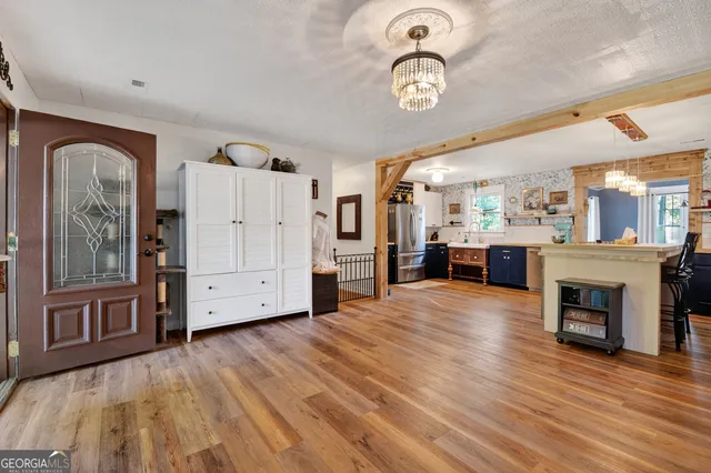 a view of a kitchen with furniture and a fireplace