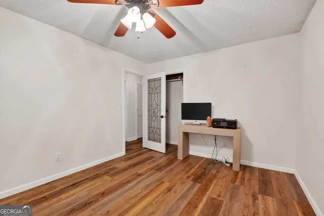 a room with a bed and a flat screen tv