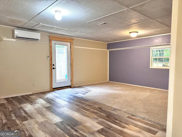 a view of an empty room and window