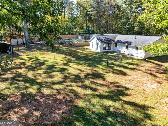 a view of a swimming pool with a patio