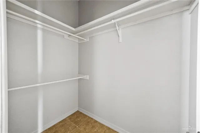 a view of an empty walk in closet