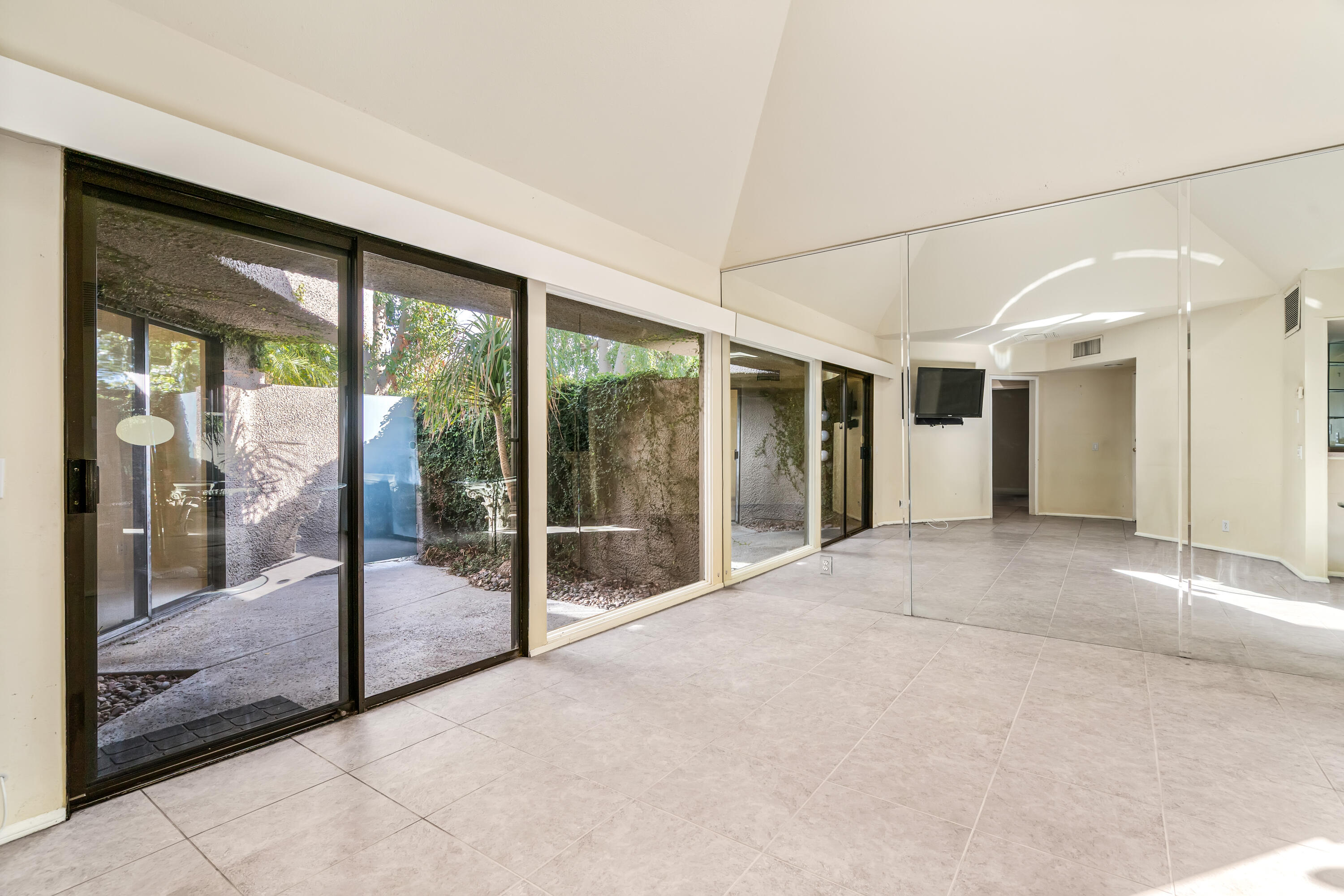 71990 Eleanora Lane Rancho Mirage, CA 92270 - Photo 3 of 22 a view of empty room with floor to ceiling window