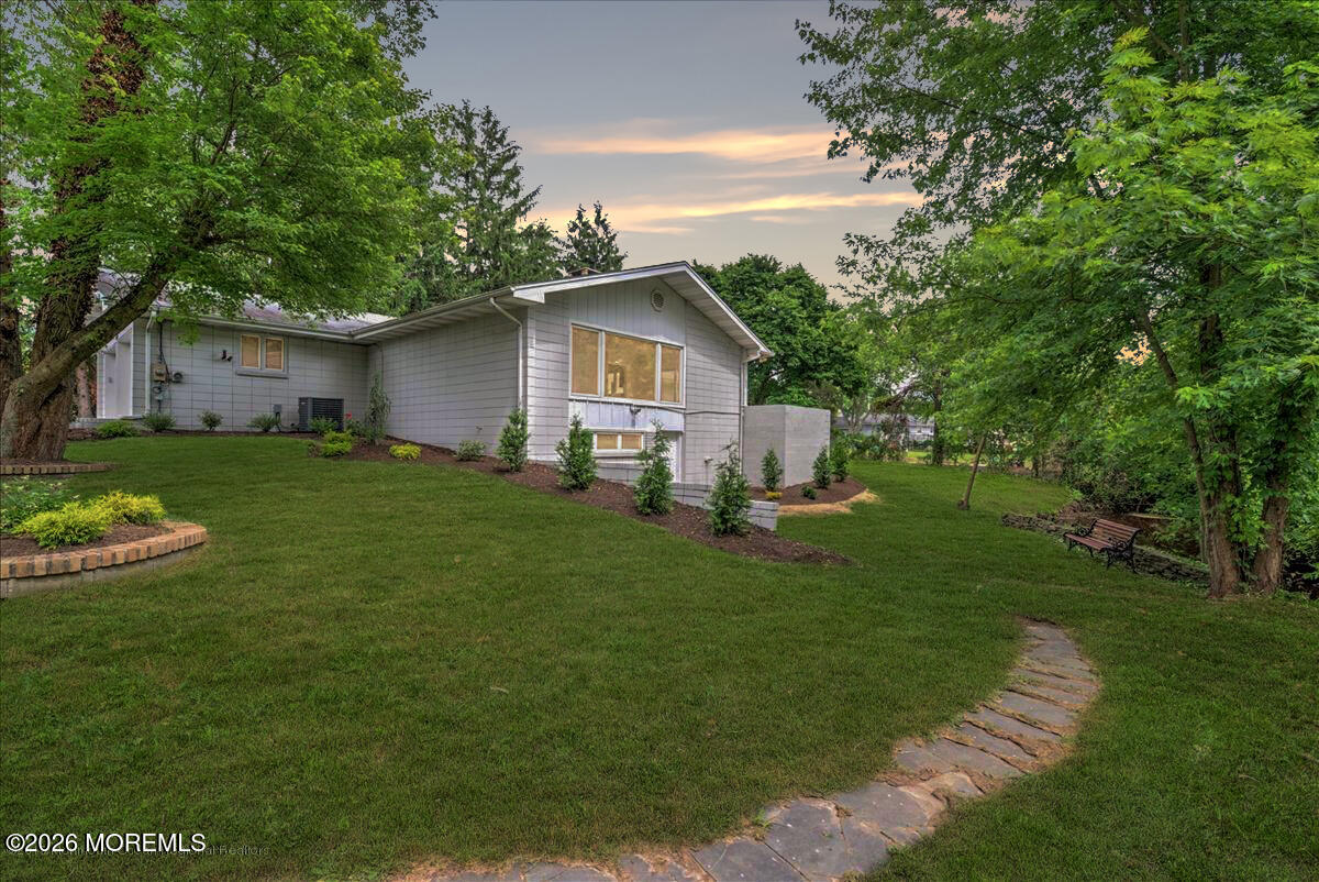 699 Aldrich Road Howell, NJ 07731 - Photo 2 of 23 a view of a house with a yard and sitting area