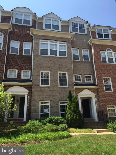 a front view of a building with garden