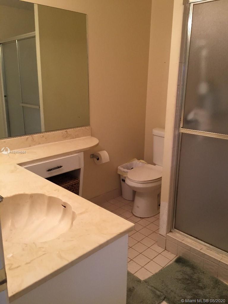 737 Banks Road Margate, FL 33063 - Photo 14 of 19 a bathroom with a sink and a toilet