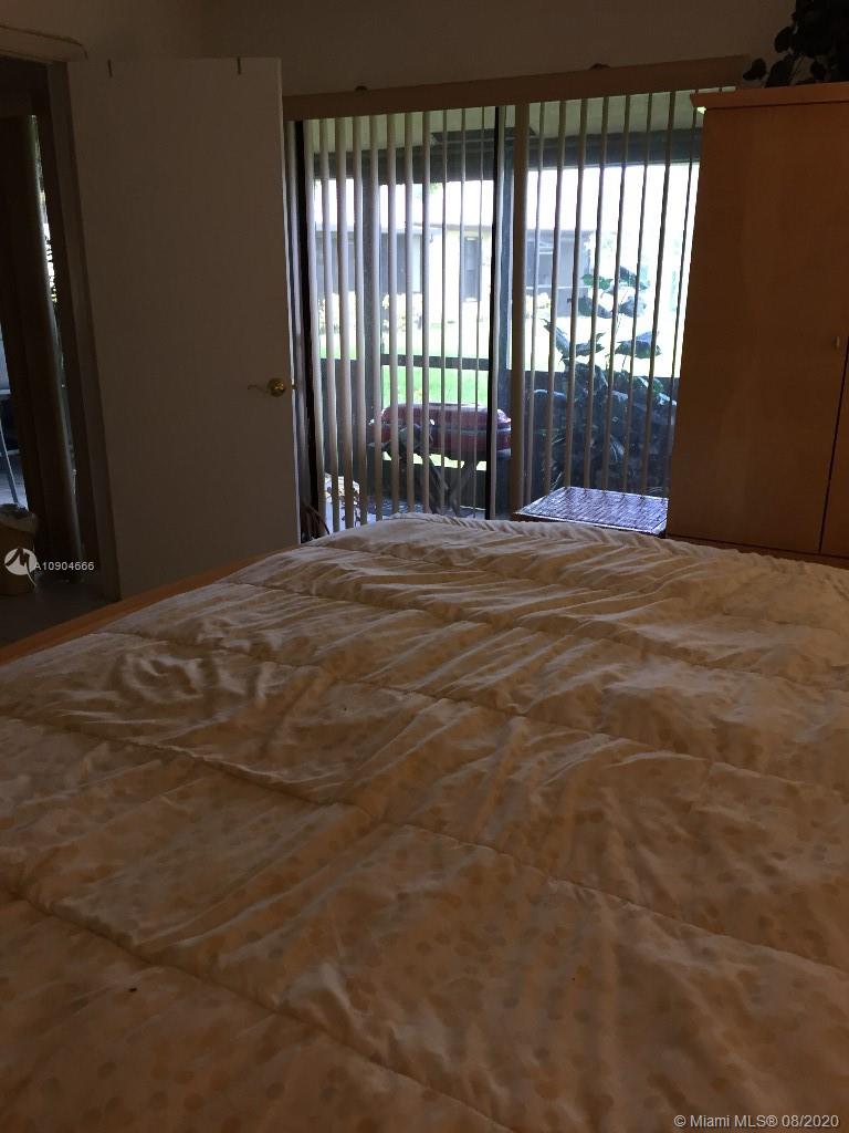 737 Banks Road Margate, FL 33063 - Photo 8 of 19 a view of empty room with floor to ceiling window