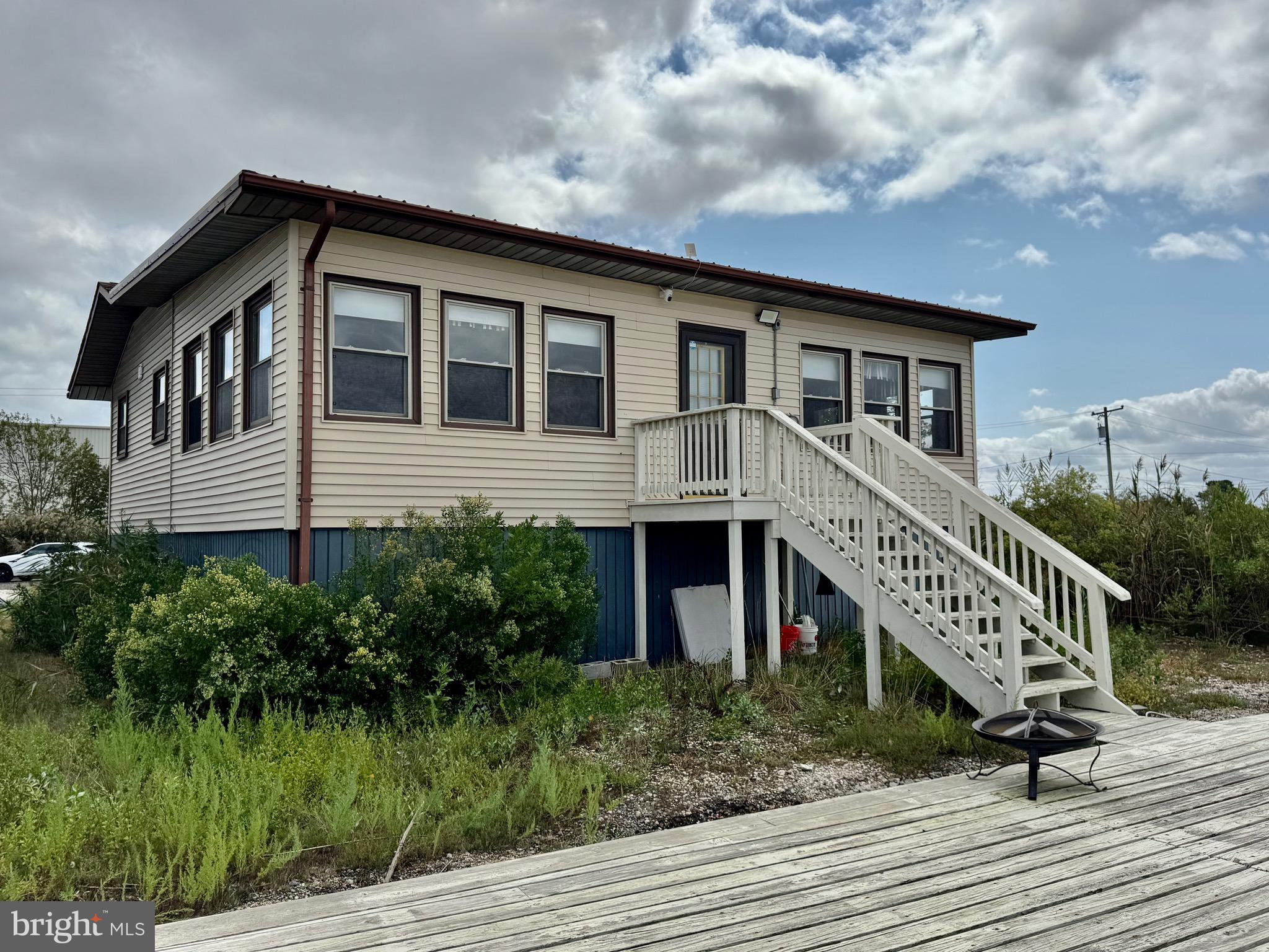 128 Sawyer Road Milford, DE 19963 - Photo 4 of 47 a front view of a house with a yard