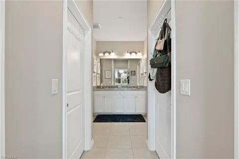 a bathroom with a sink a mirror and shower