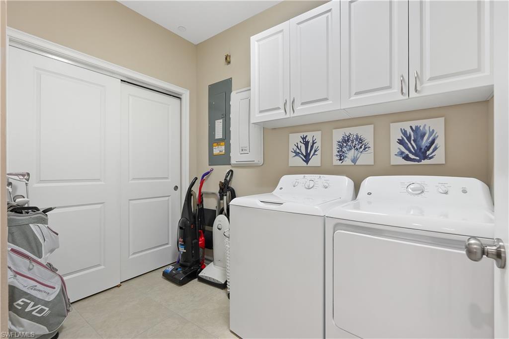 9386 Pocida Court, Unit 103 Naples, FL 34119 - Photo 20 of 43 a view of storage and utility room with washer and dryer