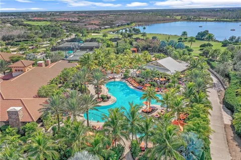 an aerial view of a houses with a lake view