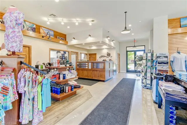 a living room filled with furniture and a book shelf