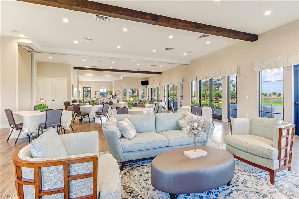 9386 Pocida Court, Unit 103 Naples, FL 34119 - Photo 43 of 43 a living room with furniture and a large window