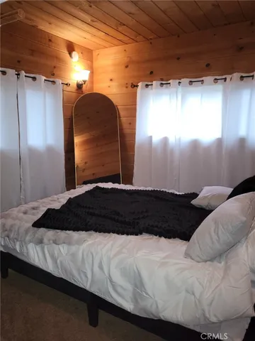 a bedroom with a bed and a walk in closet