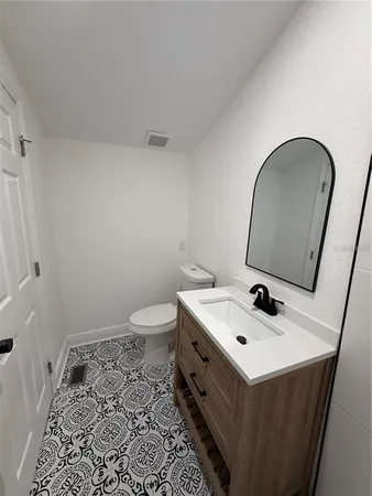 a white toilet sitting in a bathroom