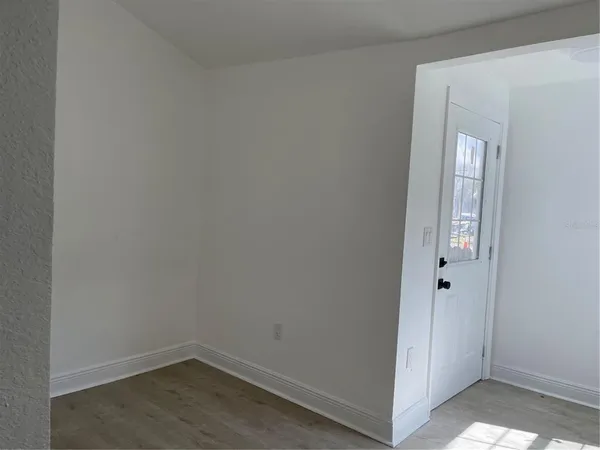 an empty room with a empty space and windows