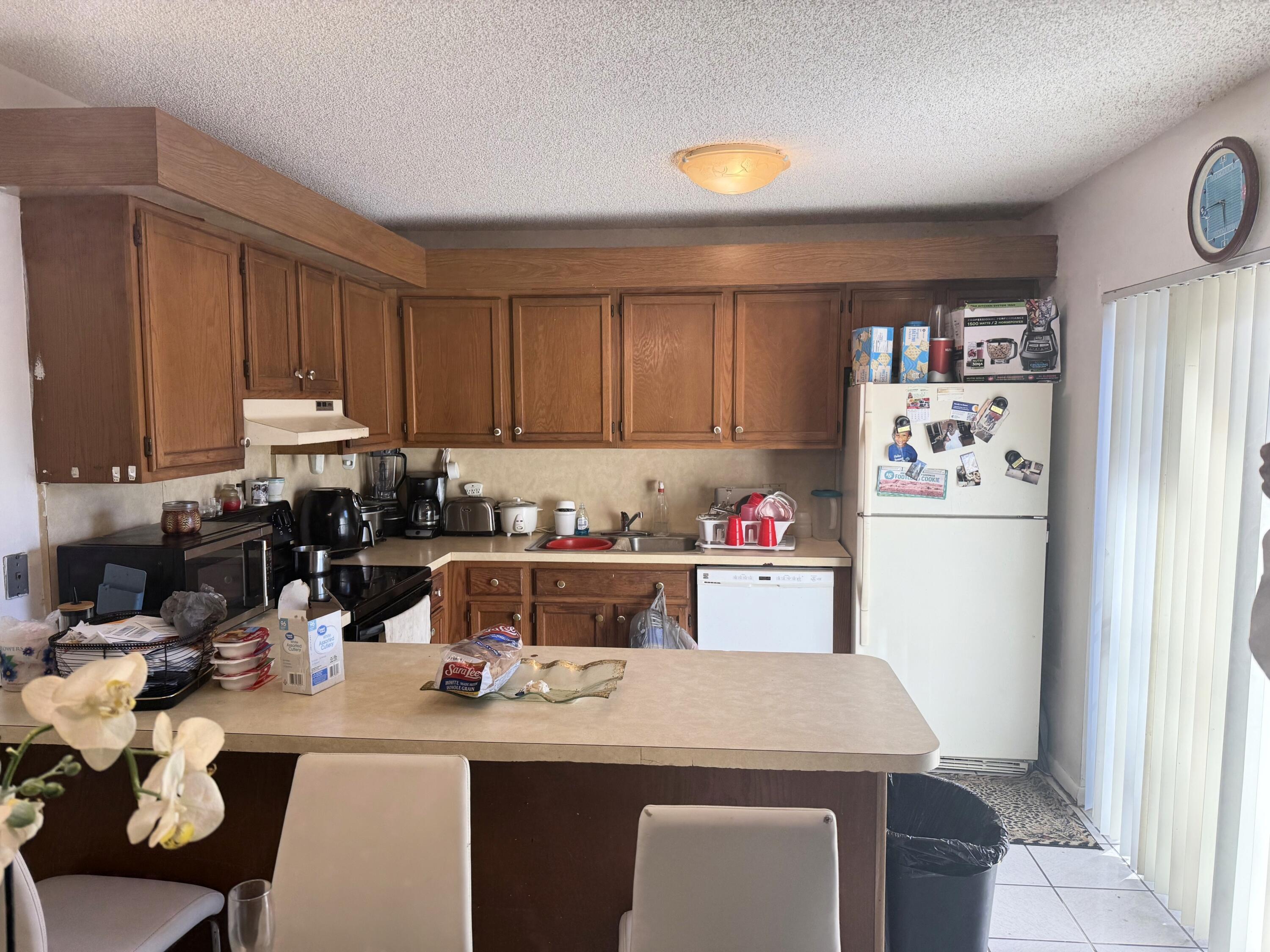 5818 Southeast Windsong Lane, Unit 212 Stuart, FL 34997 - Photo 16 of 20 5818 kitchen