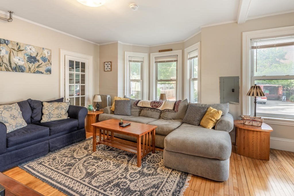 109 Chestnut Street, Unit 109 Waltham, MA 02453 - Photo 4 of 18 a living room with furniture rug and window