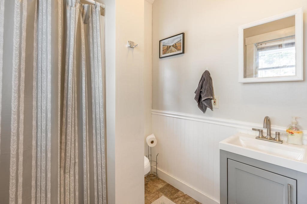 109 Chestnut Street, Unit 109 Waltham, MA 02453 - Photo 9 of 18 a bathroom with a sink and a mirror