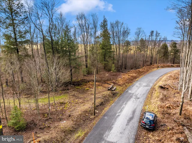 a view of a backyard of the house
