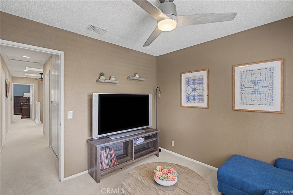 1129 Vía Nice Redlands, CA 92374 - Photo 12 of 23 a living room with furniture and a flat screen tv