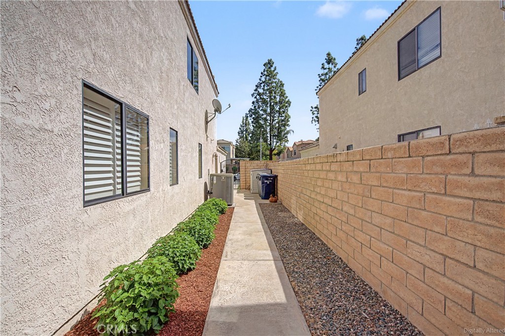1129 Vía Nice Redlands, CA 92374 - Photo 16 of 23 a pathway of a house with a yard