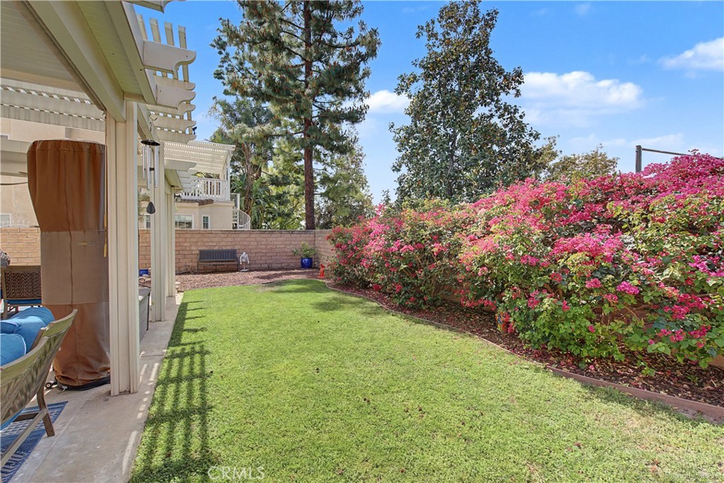 1129 Vía Nice Redlands, CA 92374 - Photo 18 of 23 a backyard of a house with lots of green space