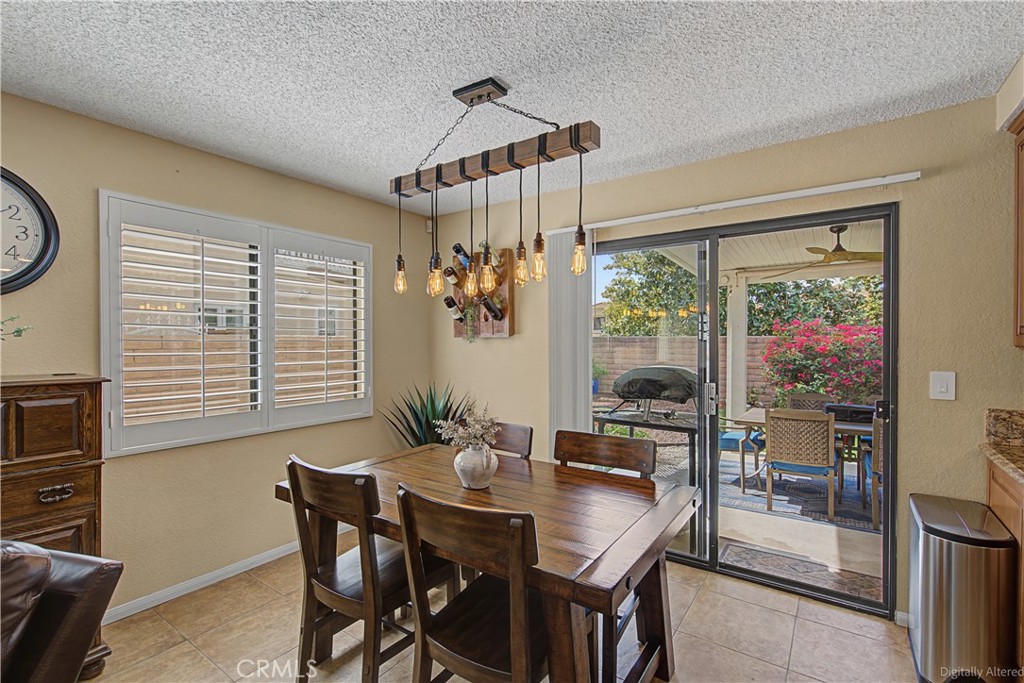 1129 Vía Nice Redlands, CA 92374 - Photo 7 of 23 a view of a dining room with furniture window and outside view