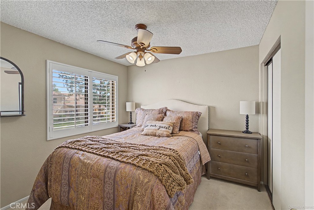 1129 Vía Nice Redlands, CA 92374 - Photo 10 of 23 a bedroom with a large bed and a window