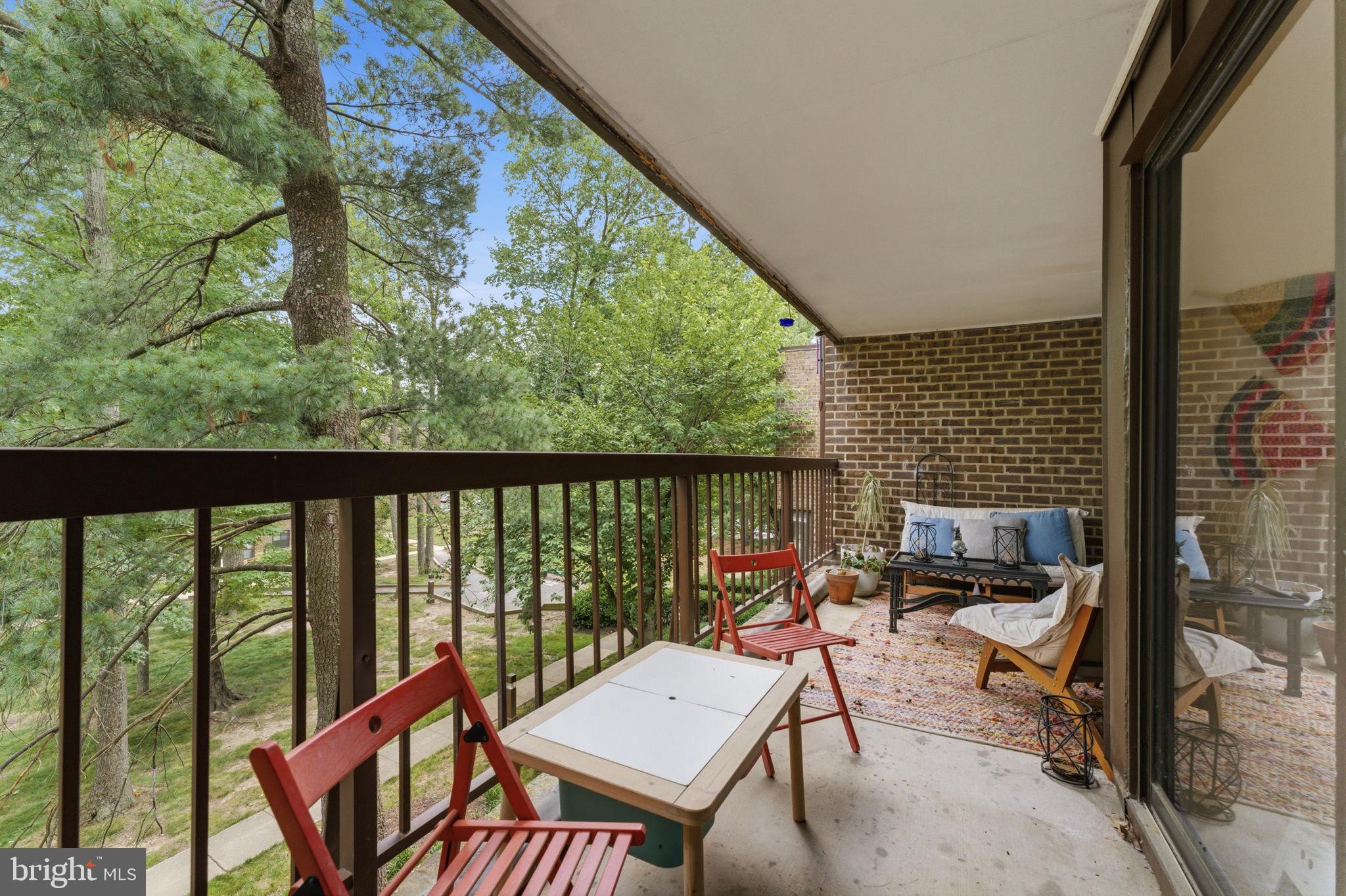 11260 Chestnut Grove Square, Unit 337 Reston, VA 20190 - Photo 28 of 82 Serene balcony with lush greenery views.
